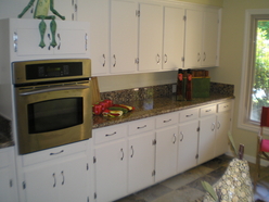New Granite Countertops and Appliances with gas stove, New White Cabinet Paint and Hardware, New Kitchen Sink and Faucet.