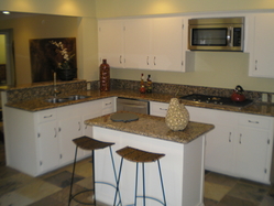 New Granite Countertops and Appliances with gas stove, New White Cabinet Paint and Hardware, New Kitchen Sink and Faucet.