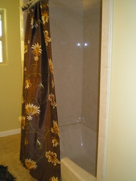 Bathroom Remodeling New Bath Tub with Shower in Light Tan Marbled Design, New Darker Marbled Tan Ceramic Tile Flooring