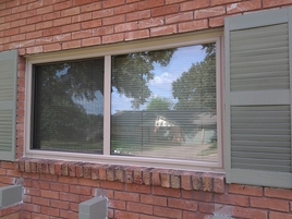 Replacement Window Almond Color Slider. Replacement Insulated Windows.