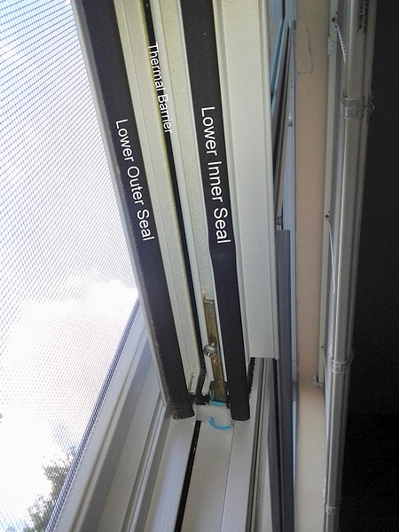 Window Silver Frame Open Showing the Lower Seals and Thermal Barrier