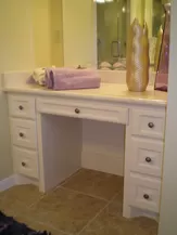 Bathroom Remodeling Project Picture New Light Tan Solid Surface Sink Vanity with White Painted Cabinets, New Brushed Silver Hardware and Tan Tile Flooring