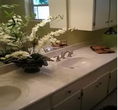 Bathroom Remodeling New Countertop with Dual Sinks and Brushed Silver Faucet Hardware, New Off White Painted Cabinets, New Tile Flooring