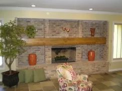 Living Room After New Fireplace Mantel, New Lighting, New Paint and New Slate Tile.