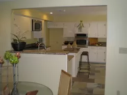 New Granite Countertops and Appliances with gas stove, New White Cabinet Paint and Hardware, New Kitchen Sink and Faucet.