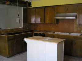 Kitchen Remodeling During. Removed old countertops and cook top. Removed lightening fixtures. Kitchen Renovation.