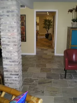 Living Room After Flooring, New Slate Flooring, New Wall and Trim Paint.