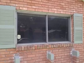 Replacement Window. Slider Type. Before of Before and After. Replacement Insulated Window.