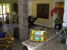 Living Room After Wet Bar, New Paint, New Granite Countertops and New Slate Tile.