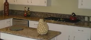 Kitchen Remodeling Stainless Steel Gas Range with Granite Countertops and Backsplash with new White Paint and New Hardware