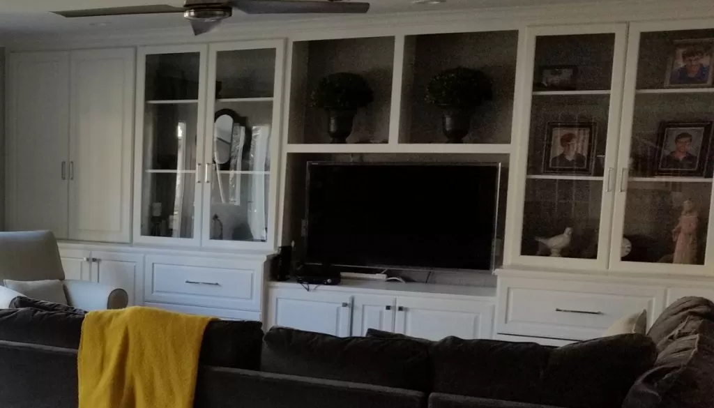 Home Remodeling Entertainment Center New Cabinets with Glass Doors. New White Paint and Hardware.