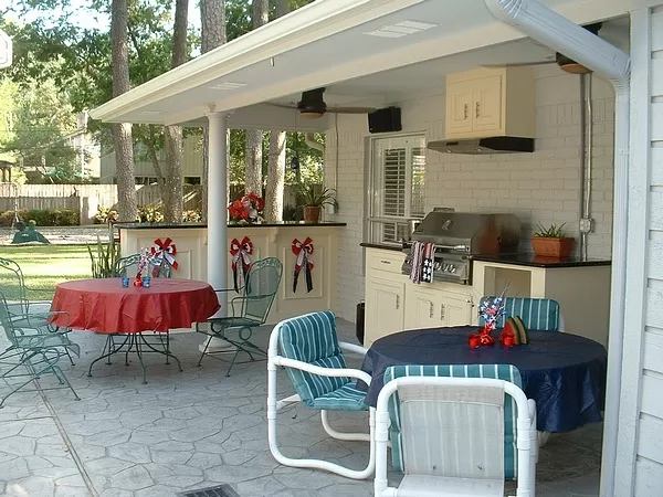 Outdoor Kitchen Project Picture After Gas Grill with Side Burner, Cabinets, Exhaust Vent, Bar, Drop Lights, Fans and Speakers. Outside Kitchens.