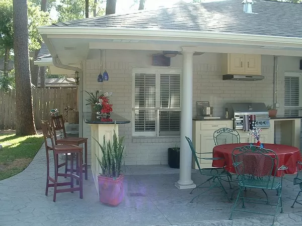 Outdoor Kitchen Project Picture After Gas Grill, Cabinets, Exhaust Vent, Bar, Drop Lights, Fans and Speakers. Outside Kitchens.